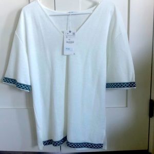 White shirt with green and blue trim